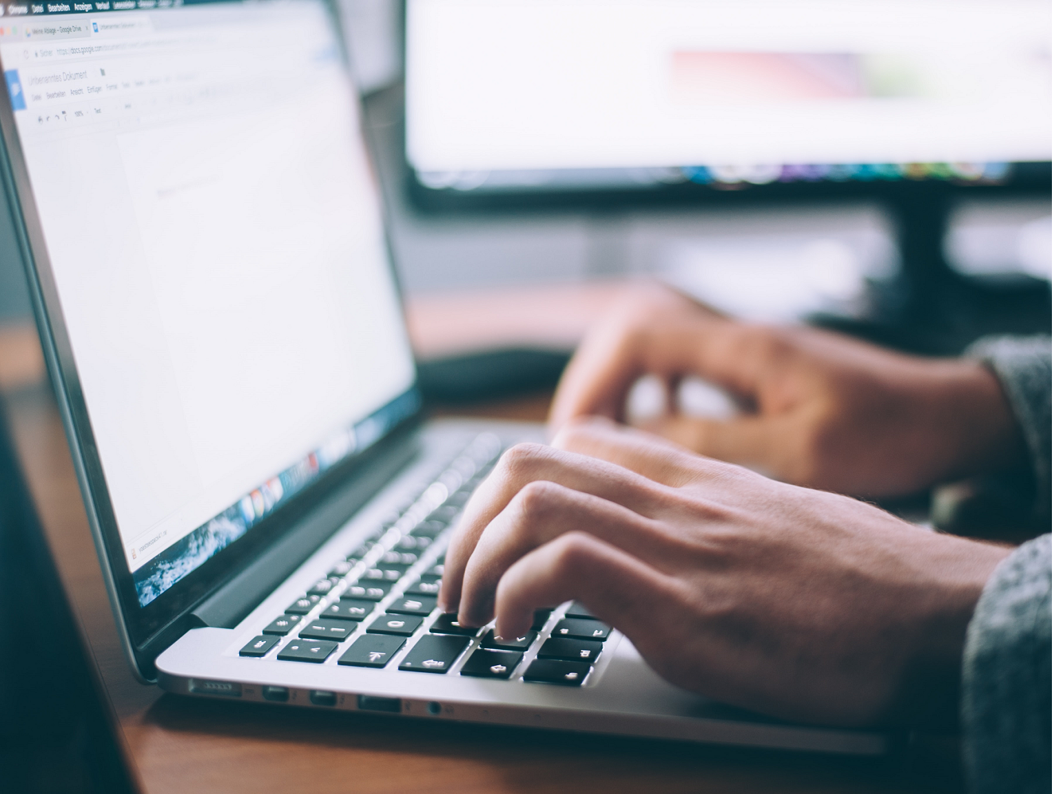 Computer with person typing